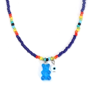 Colorful beaded necklace with blue resin bear and evil eye pendant on white background