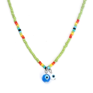Close-up of green beaded necklace featuring colorful accents and blue evil eye charms