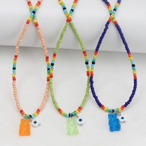 Handmade bead necklaces with colorful resin gummy bear and evil eye charms for women