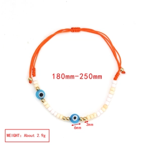 Detail showing adjustable orange evil eye bracelet with blue glass beads and size measurements