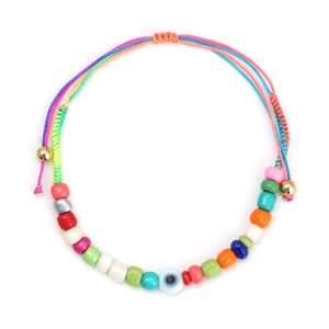Detail of handmade evil eye bracelet with colorful beads and adjustable woven cord