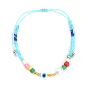 Detailed shot of evil eye bead with colorful glass pearls on adjustable blue woven cord