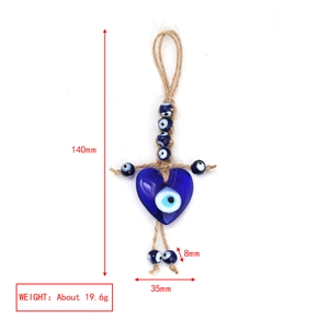 Detailed view of the 140mm heart-shaped blue eye charm with size and weight measurements