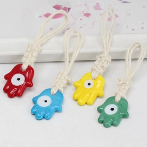 Hamsa Hand pendants with evil eye in four colors on woven hemp ropes for keychains
