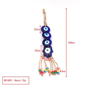 Detail of Turkish Evil Eye pendant with Hamsa charm, rope textures, and colorful beads