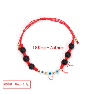 Detailed view of adjustable evil eye bracelet with red cord and lava beads, size 180-250mm