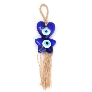 Detailed view of handmade evil eye charm with blue glass hearts and hemp rope fringe