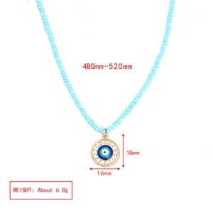 Detail view of evil eye beaded necklace with pendant measurements and product weight info