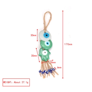 Detail view of the Evil Eye and Hamsa charm with dimensions 170mm and weight 27.1g