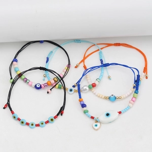 Bohemian evil eye bead bracelets with adjustable colorful woven ropes and resin charms