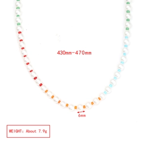 Detailed view of bead necklace with 6mm pearls and colorful cylindrical accents