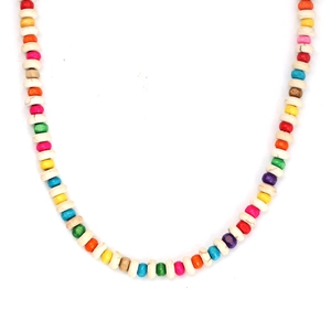 Detail view of vibrant multi-colored beaded necklace with bohemian style resin discs