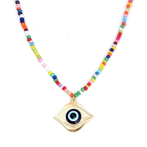 Close-up of colorful seed beads necklace with a golden evil eye pendant on white backdrop