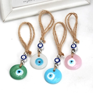 Detailed set of four colorful Evil Eye wall hangings with rustic hemp rope and silver beads