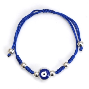 Detail of blue woven evil eye bracelet with adjustable cord and silver metallic beads