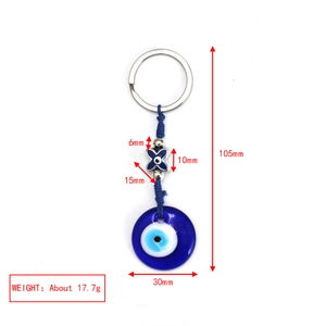 Vista dettagliata del portachiavi Evil Eye in vetro con dimensioni e segni di peso