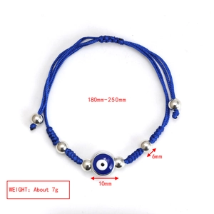 Detailed view of woven blue rope bracelet with silver beads and evil eye charm and dimensions