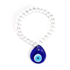 Detail of beaded keychain featuring clear round beads and a blue glass evil eye charm