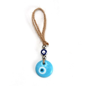 Detail of Mediterranean evil eye pendant with blue glass bead and brown jute rope