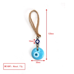 Detail showing the 120mm Nazar evil eye keychain with blue glass beads and jute rope cord