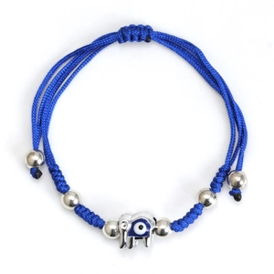 Detailed close-up of blue braided cord bracelet featuring silver elephant evil eye charm