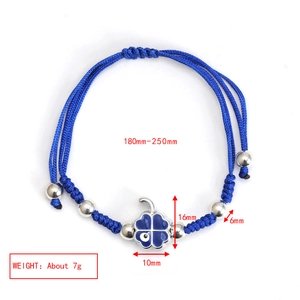 Detail of blue braided rope bracelet with adjustable drawstring and clover charm