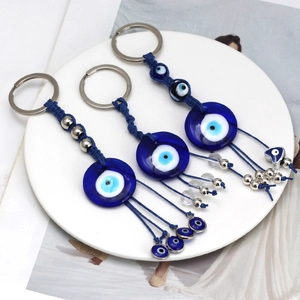 Set di tre portachiavi malocchio in vetro blu con corde intrecciate e anelli metallici