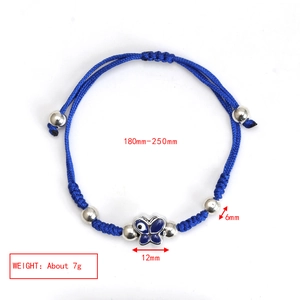Detail view of adjustable blue cord bracelet with evil eye charm and size dimensions