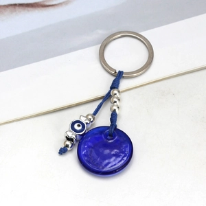 Portachiavi occhio di Allah in vetro blu con perline d'argento e corda intrecciata