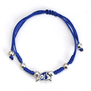 Detail of blue braided rope bracelet featuring silver beads and evil eye wing charm