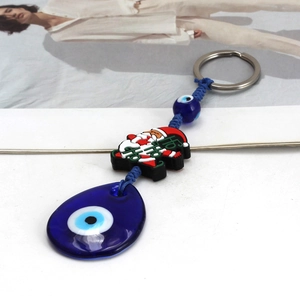 Christmas Evil Eye keychain with Santa Ho Ho Ho charm and blue glass teardrop pendant
