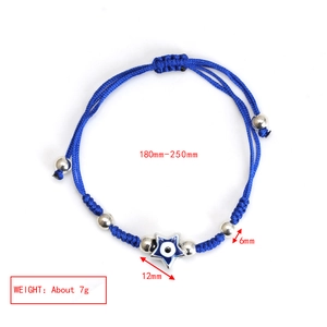 Detail view of blue braided evil eye star bracelet with adjustable silver beads