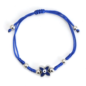 Detail of blue braided rope bracelet featuring an enamel evil eye butterfly charm and silver beads