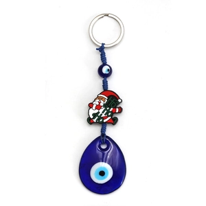 Detail of Christmas Evil Eye keychain with Ho Ho Ho Santa charm and blue glass teardrop