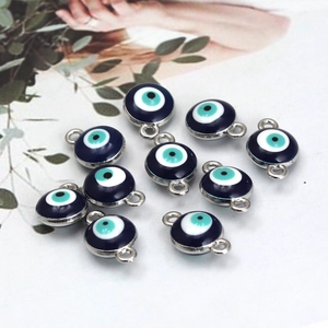 Macro shot of blue enamel Evil Eye charms and connectors for DIY jewelry making