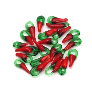 Handmade red glass chili pendants for DIY jewelry making with green tops on white background