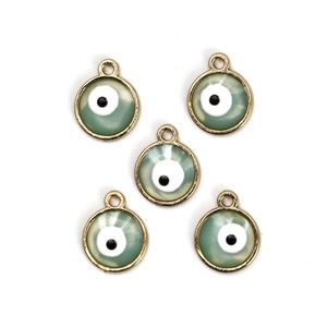 Detailed macro view of five light green evil eye charms with gold metal plating for DIY jewelry