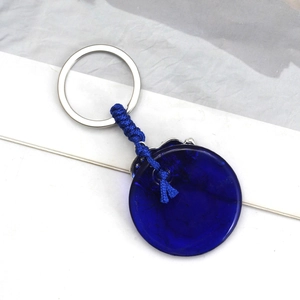 Elephant glass pendant keychain with blue evil eye bead and handmade woven rope