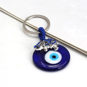 Detail view of Evil Eye elephant keychain with blue glass nazar and silver rhinestones