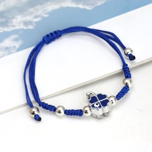 Blue woven rope bracelet with evil eye clover pendant and silver beads detail
