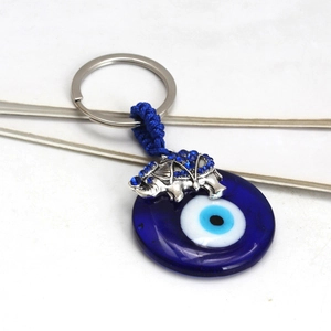 Elephant charm evil eye glass keychain with blue rhinestones and silver metal finish