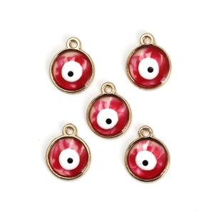 Detailed view of red evil eye charms with gold metal edges for DIY jewelry making