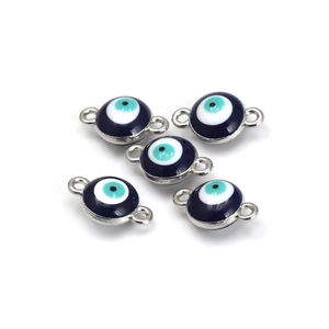 Detailed close-up of DIY evil eye jewelry connectors with dual rings and blue enamel finish