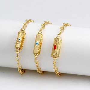 Detailed macro view of three evil eye hexagon pendants on gold plated link chains