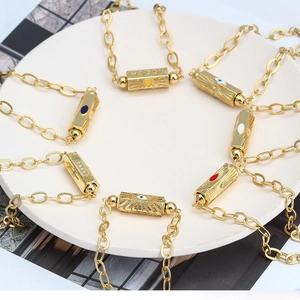 Golden Evil Eye hexagonal prism bracelet with Happy engraving and sunburst pattern detail