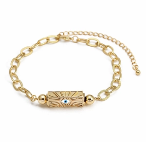 Detailed close-up of golden evil eye sunburst pendant on a high-quality link chain bracelet