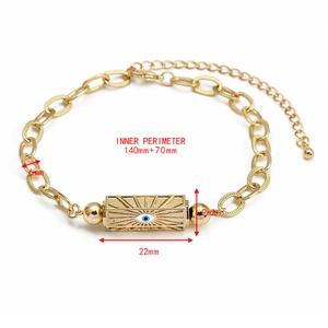 Detail view of gold Evil Eye bracelet with dimensions and polished chain texture