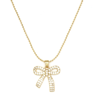 Détail du pendentif nœud en or avec zircons pavés et maille de chaîne à boules dorées