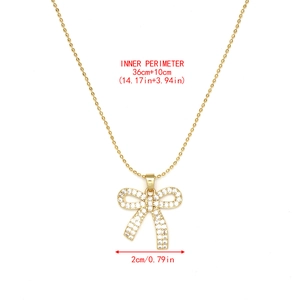 Détail du collier à billes doré ajustable avec pendentif nœud en zircon et dimensions