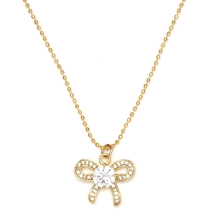 Détail du pendentif nœud doré avec grand zircon et chaîne à billes élégante
